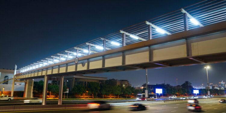 Pedestrian bridge in Dubai equipped with smart motion-sensor LED lighting.