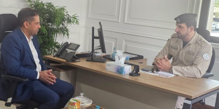 Indian Association Sharjah President Nissar Thalangara and Sharjah Police Director Dr. Saeed finalizing a labor welfare partnership agreement at the police headquarters.