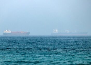 An oil tanker has been disabled off Ash Shishah, Oman, after an unidentified projectile hit its engine room. Crew reported safe as security alerts widen near Strait of Hormuz.