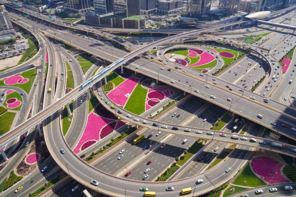 LiDAR-equipped vehicle surveying Dubai road network infrastructure at night
