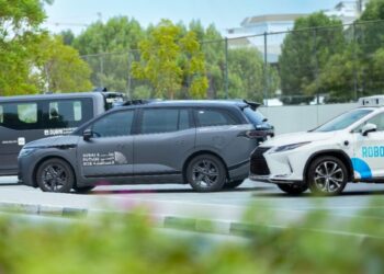 Baidu Apollo Go autonomous Robotaxi driving on a street in Dubai, UAE