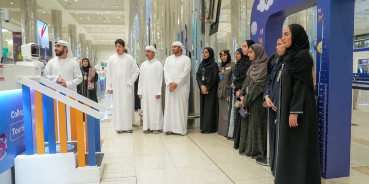 High school students participating in the GDRFA Summer Talents program at Dubai International Airport