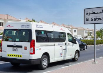 RTA Dubai Bus-On-Demand minibus operating on a city street