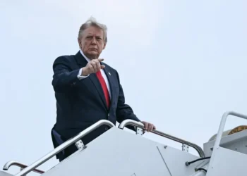 US President Donald Trump walking from Air Force One after arriving at Morristown Municipal Airport from Camp David.