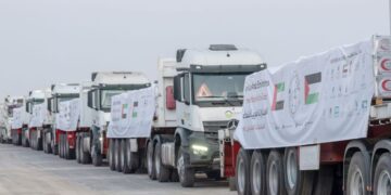 UAE humanitarian aid trucks prepared for Gaza at Al Arish logistics center.