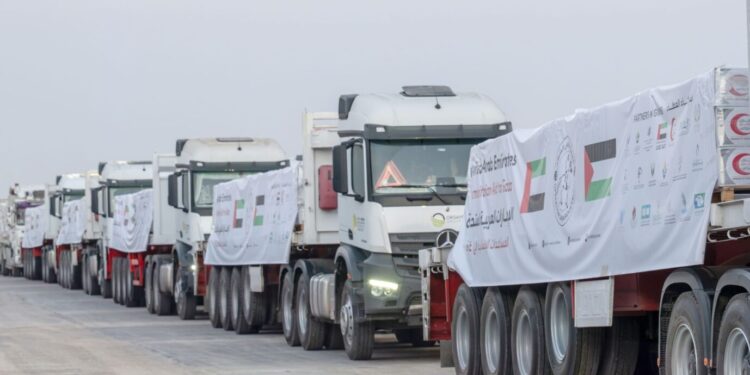 UAE humanitarian aid trucks prepared for Gaza at Al Arish logistics center.