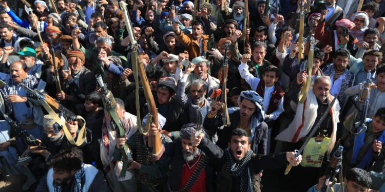 Houthi militia supporters brandish weapons as they rally in Sanaa, Yemen, on October 9, 2026.